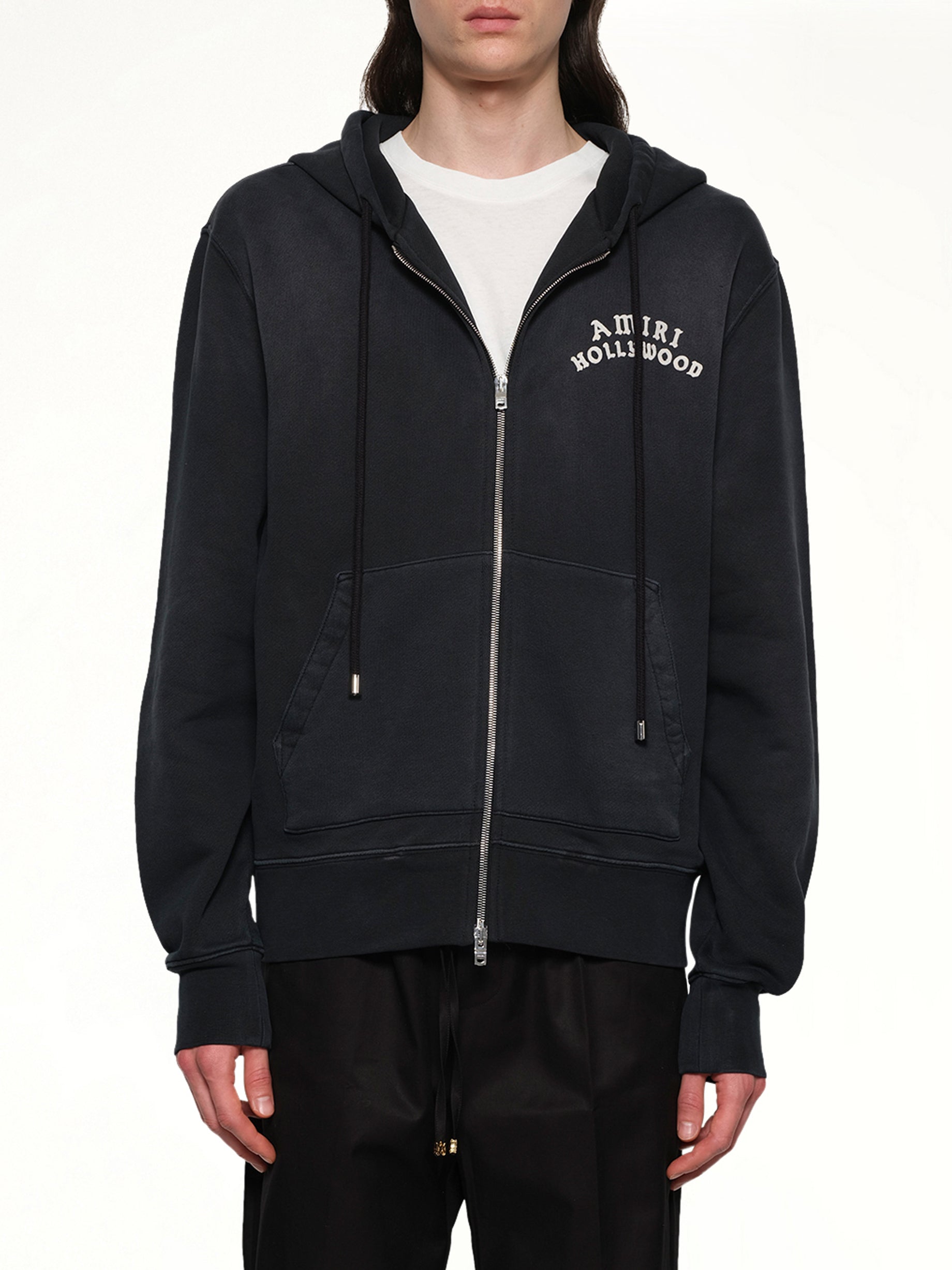 Image of a model wearing Outerwear. Product name - Amiri Hollywood Zip Hoodie in Black colour by brand - AMIRI