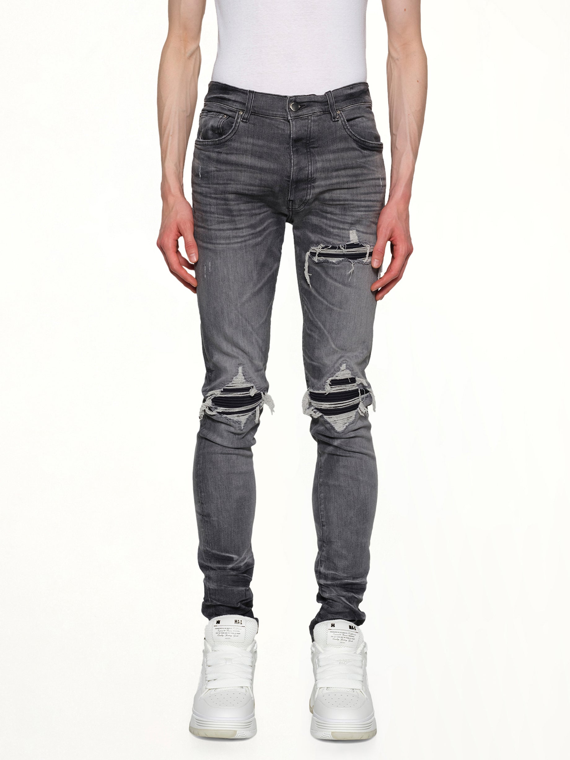 Image of a model wearing Denim. Productname: AMIRI Suede MX1 Jeans in STORM GREY colour by brand - AMIRI