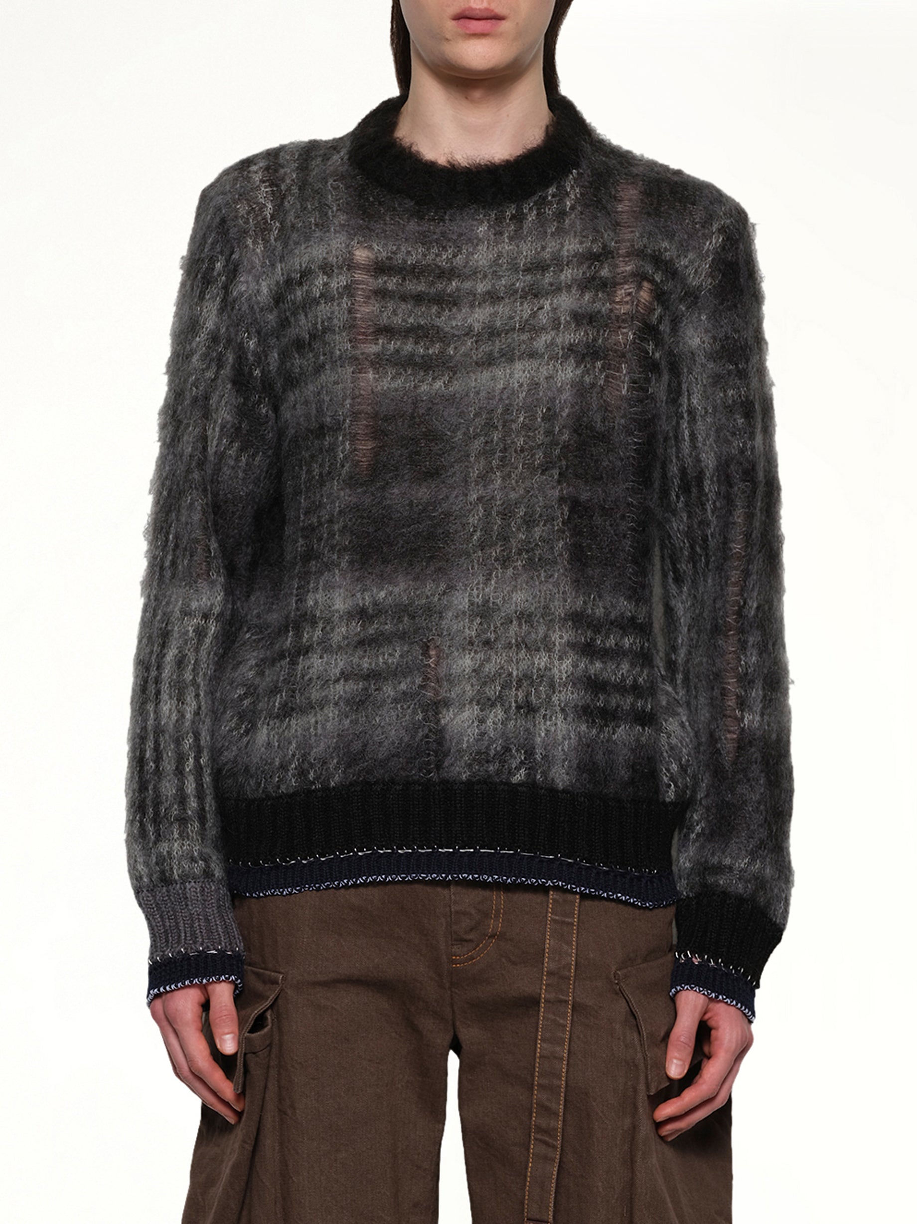Image of a model wearing Outerwear. Productname: SACAI Plaid Mohair Knit Pullover in Black colour by brand - SACAI