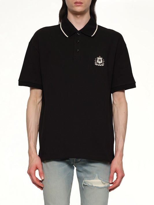 Image of a model wearing Tops. Productname: AMIRI MA Crest Polo in BLACK colour by brand - AMIRI
