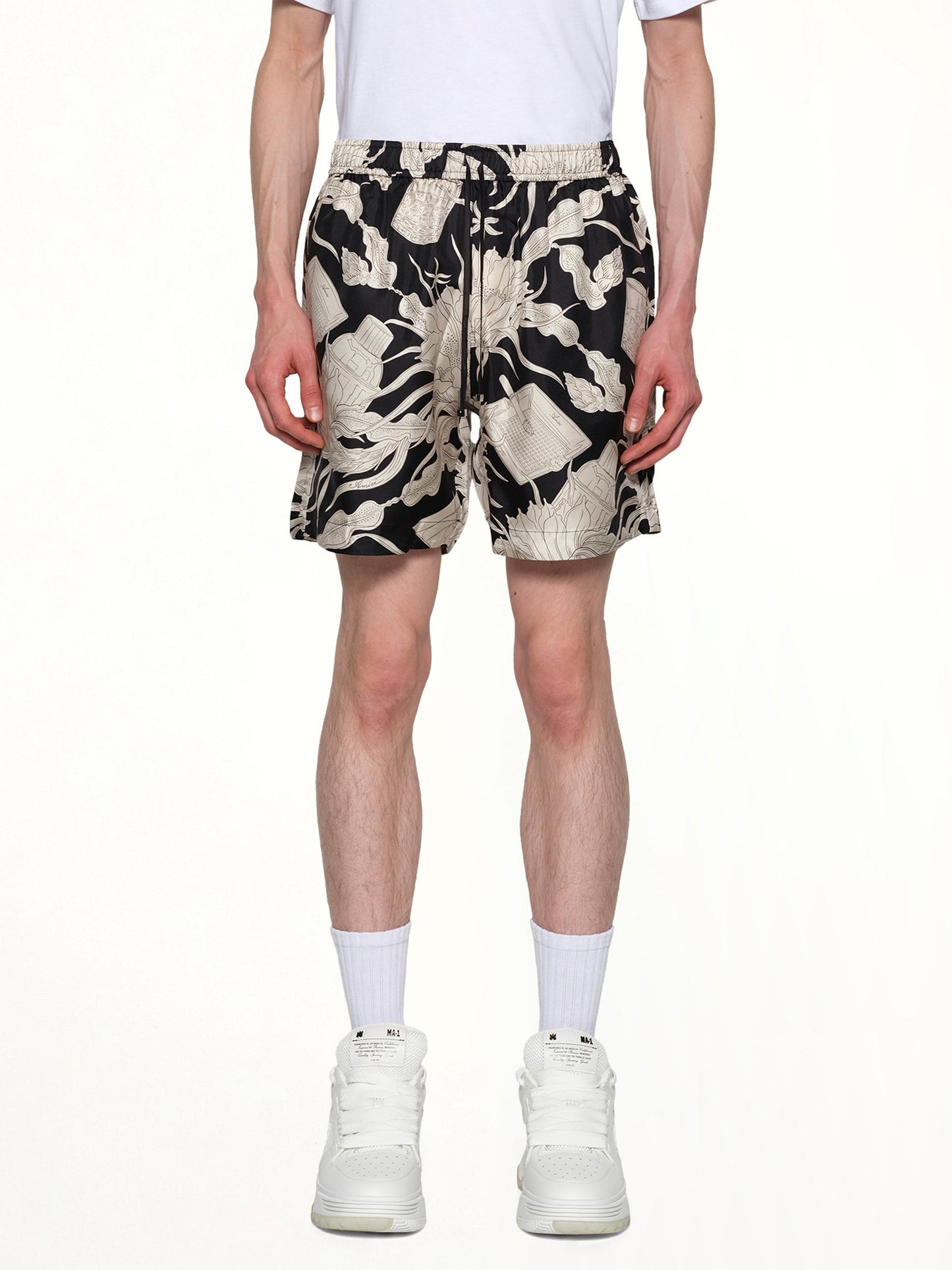 Image of a model wearing Shorts. Productname: AMIRI Floral Short in BLACK colour by brand - AMIRI