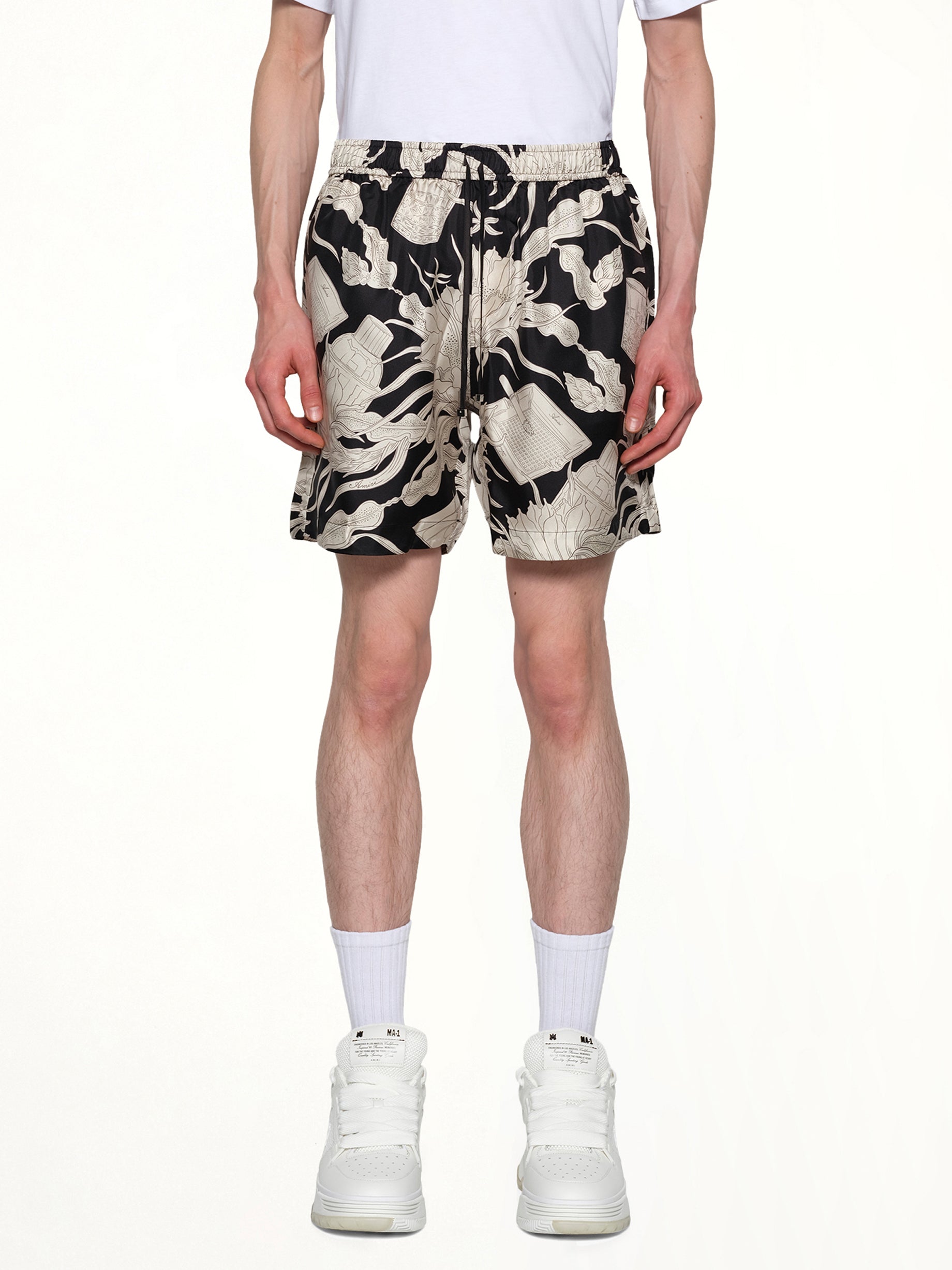 Image of a model wearing Shorts. Productname: AMIRI Floral Short in BLACK colour by brand - AMIRI