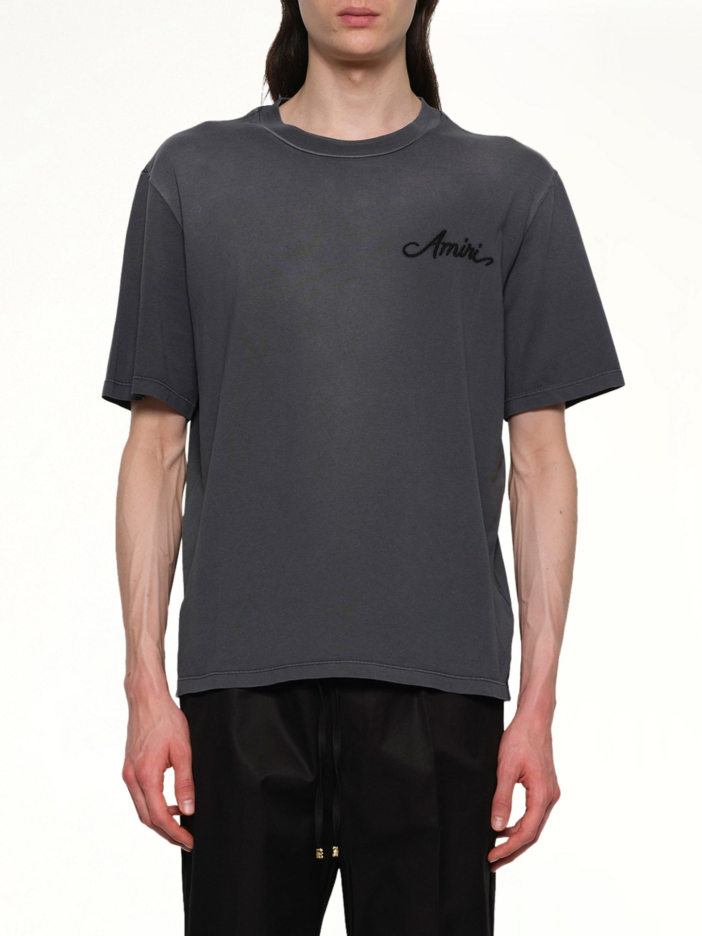 Image of a model wearing Tops. Productname: AMIRI Bleach Bandana Patch T-Shirt in BLACK colour by brand - AMIRI