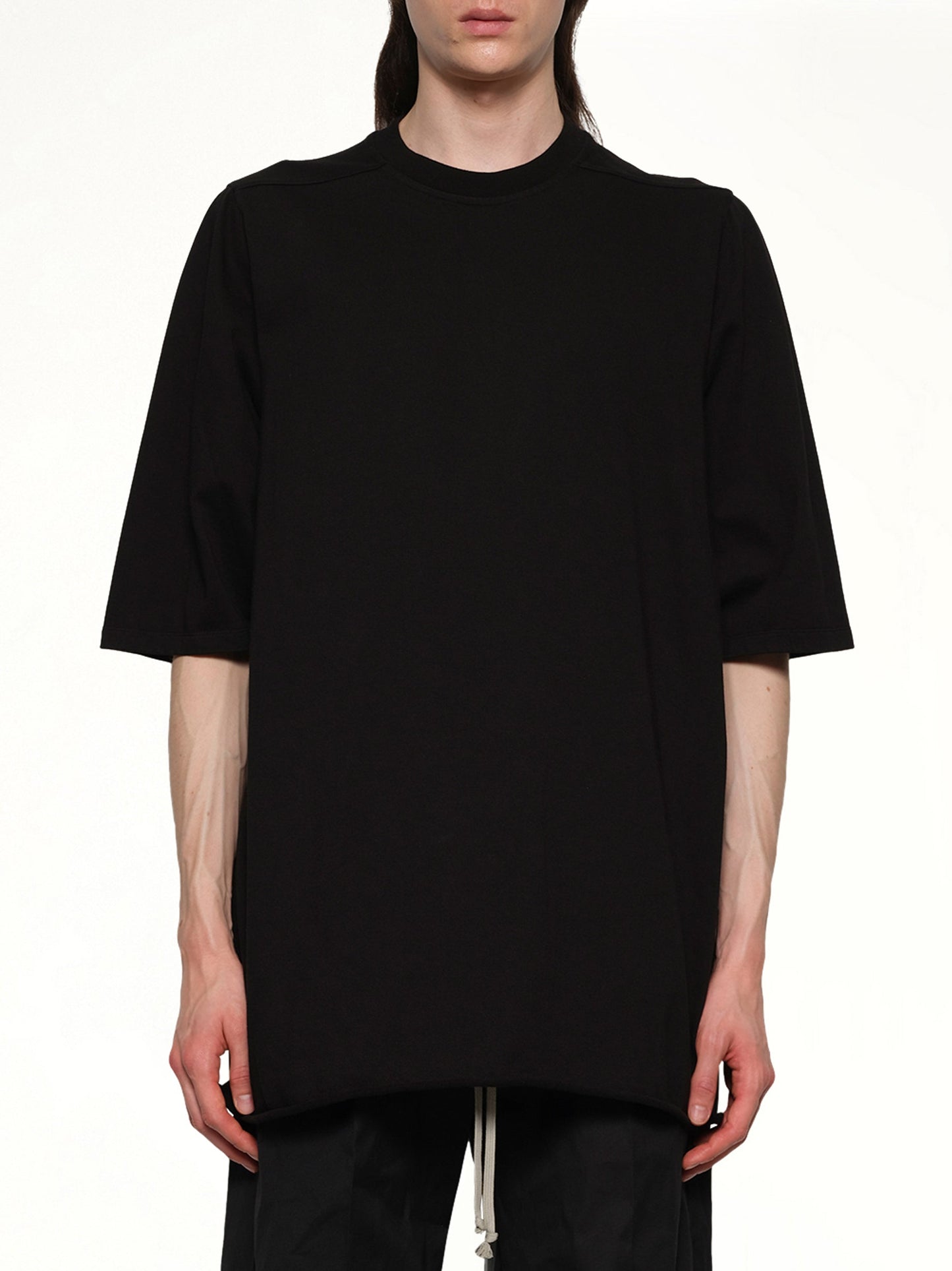 Image of a model wearing Tops. Productname: RICK OWENS Jumbo T-Shirt in Black colour by brand - RICK OWENS