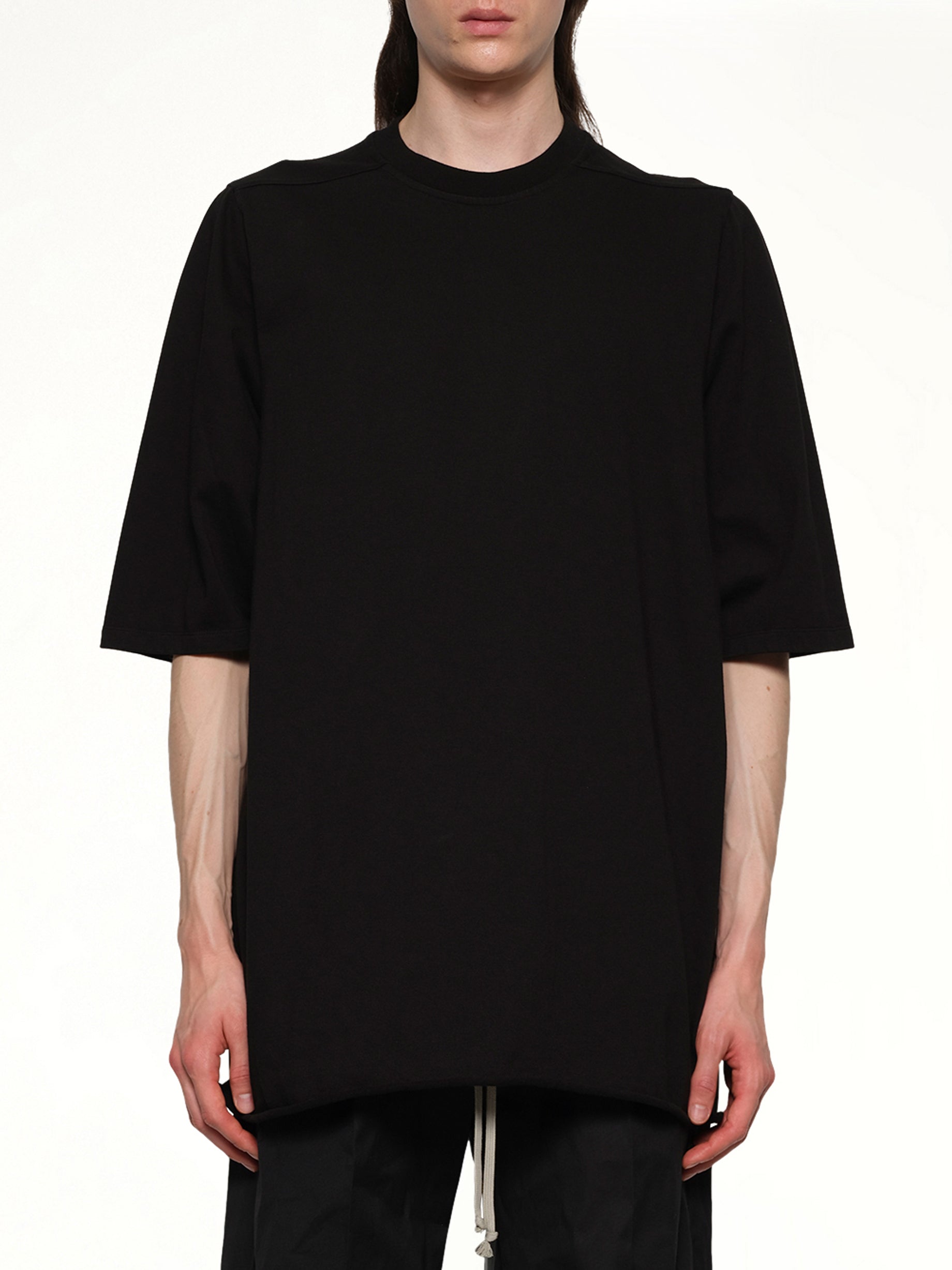 Image of a model wearing Tops. Productname: RICK OWENS Jumbo T-Shirt in Black colour by brand - RICK OWENS