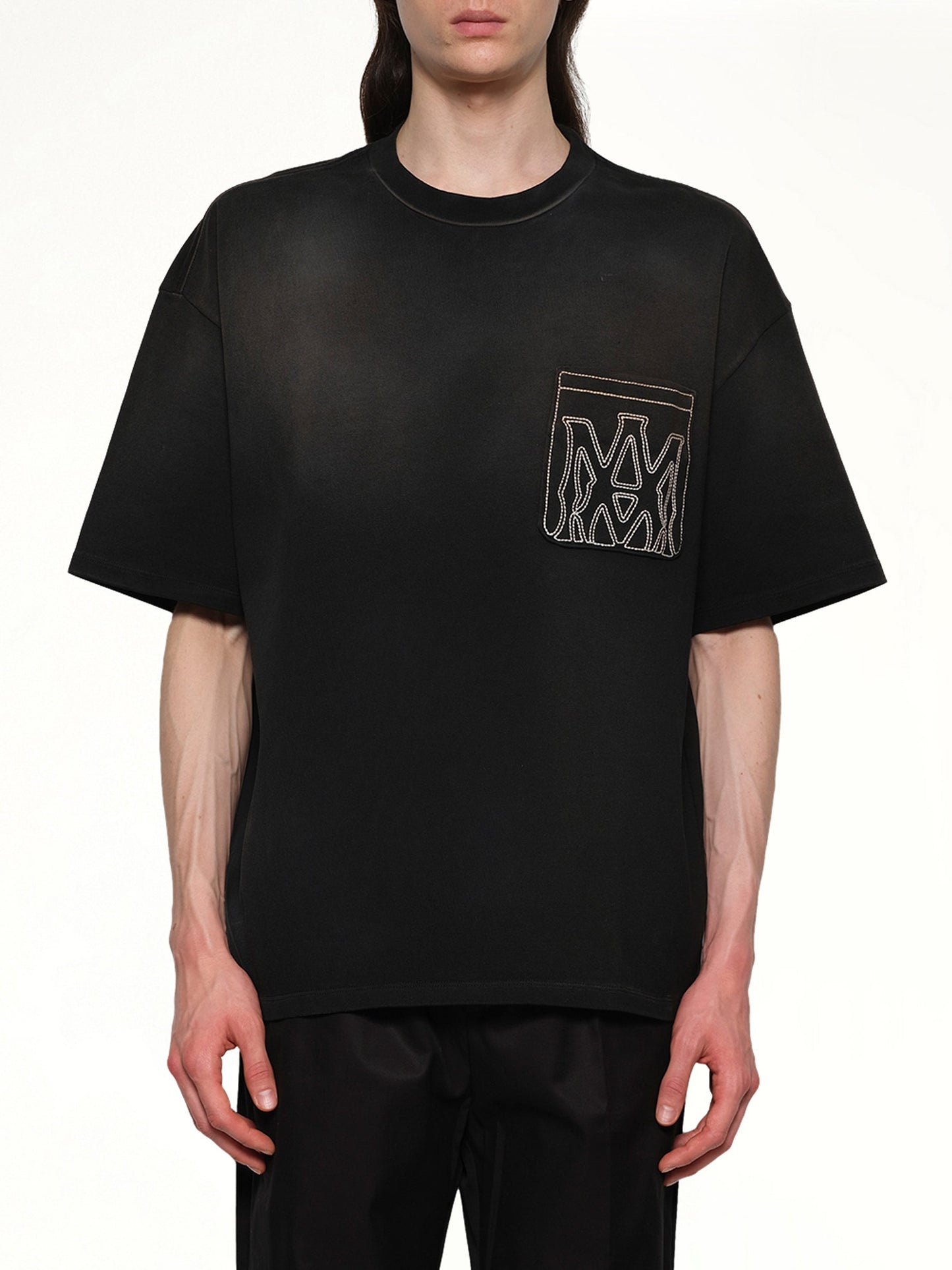 Image of a model wearing Tops. Productname: AMIRI MA Outline Oversize T-Shirt in BLACK colour by brand - AMIRI