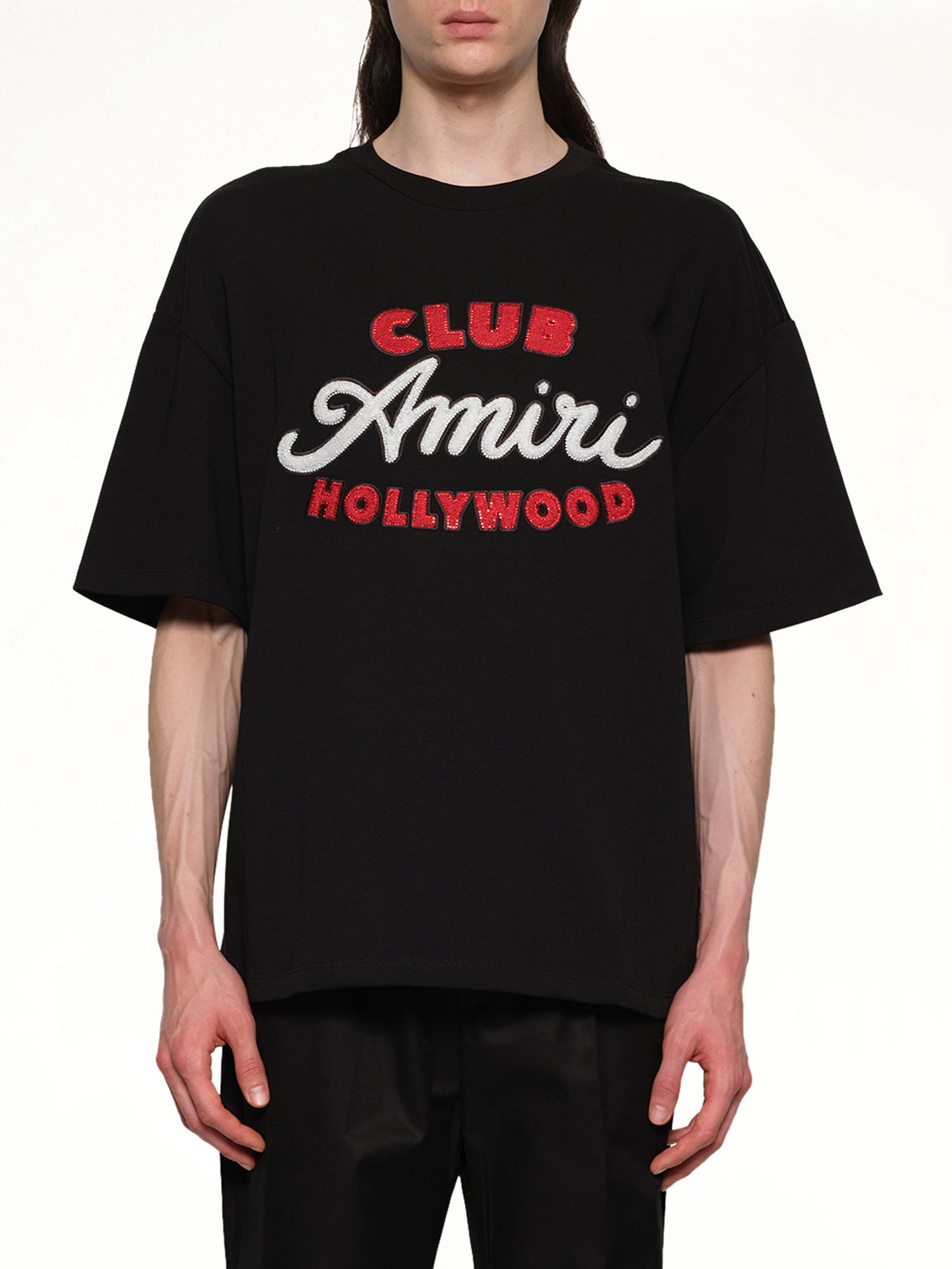Image of a model wearing Tops. Productname: AMIRI Club Amiri Overzied Tee in BLACK colour by brand - AMIRI