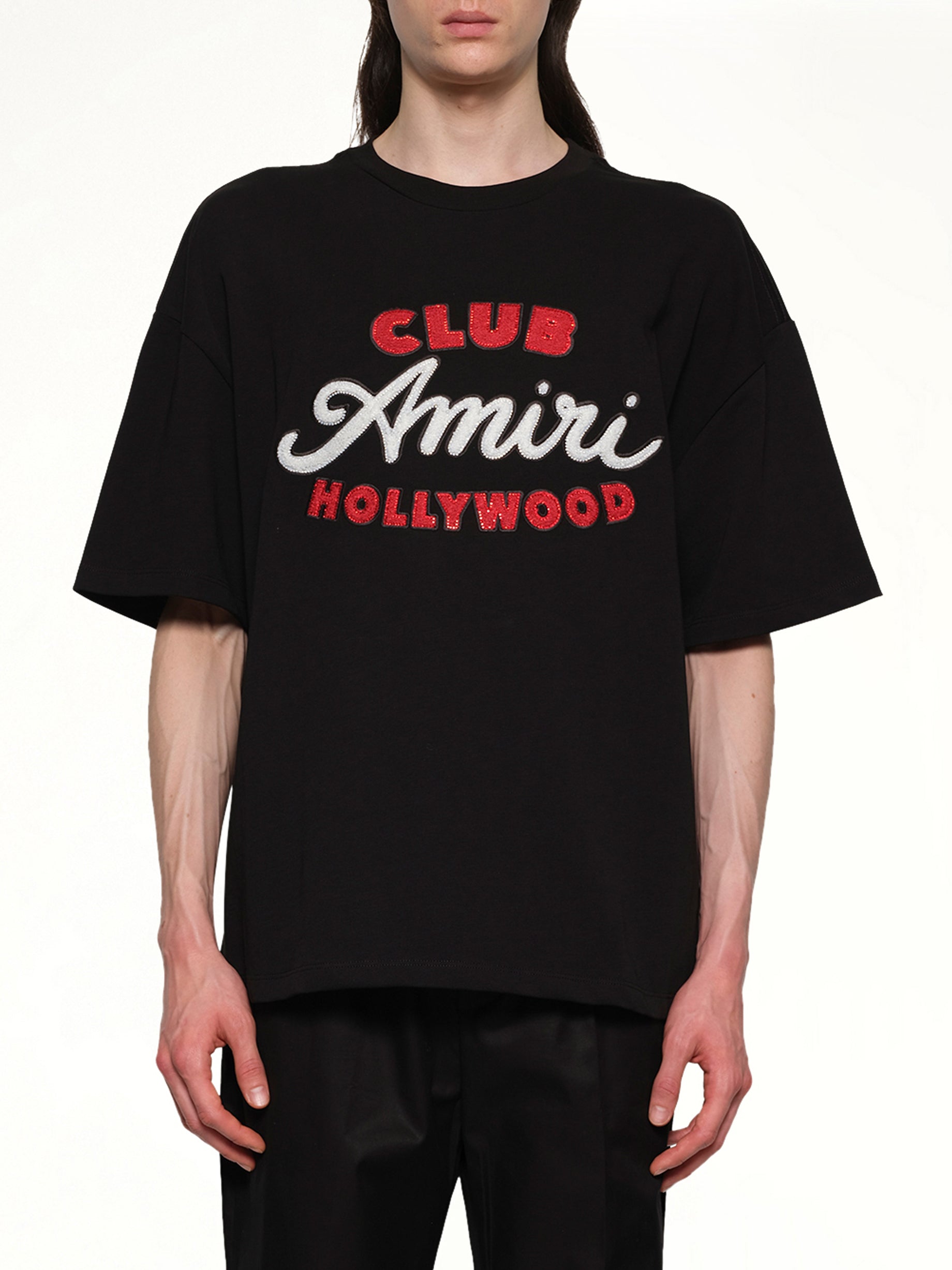 Image of a model wearing Tops. Productname: AMIRI Club Amiri Overzied Tee in BLACK colour by brand - AMIRI