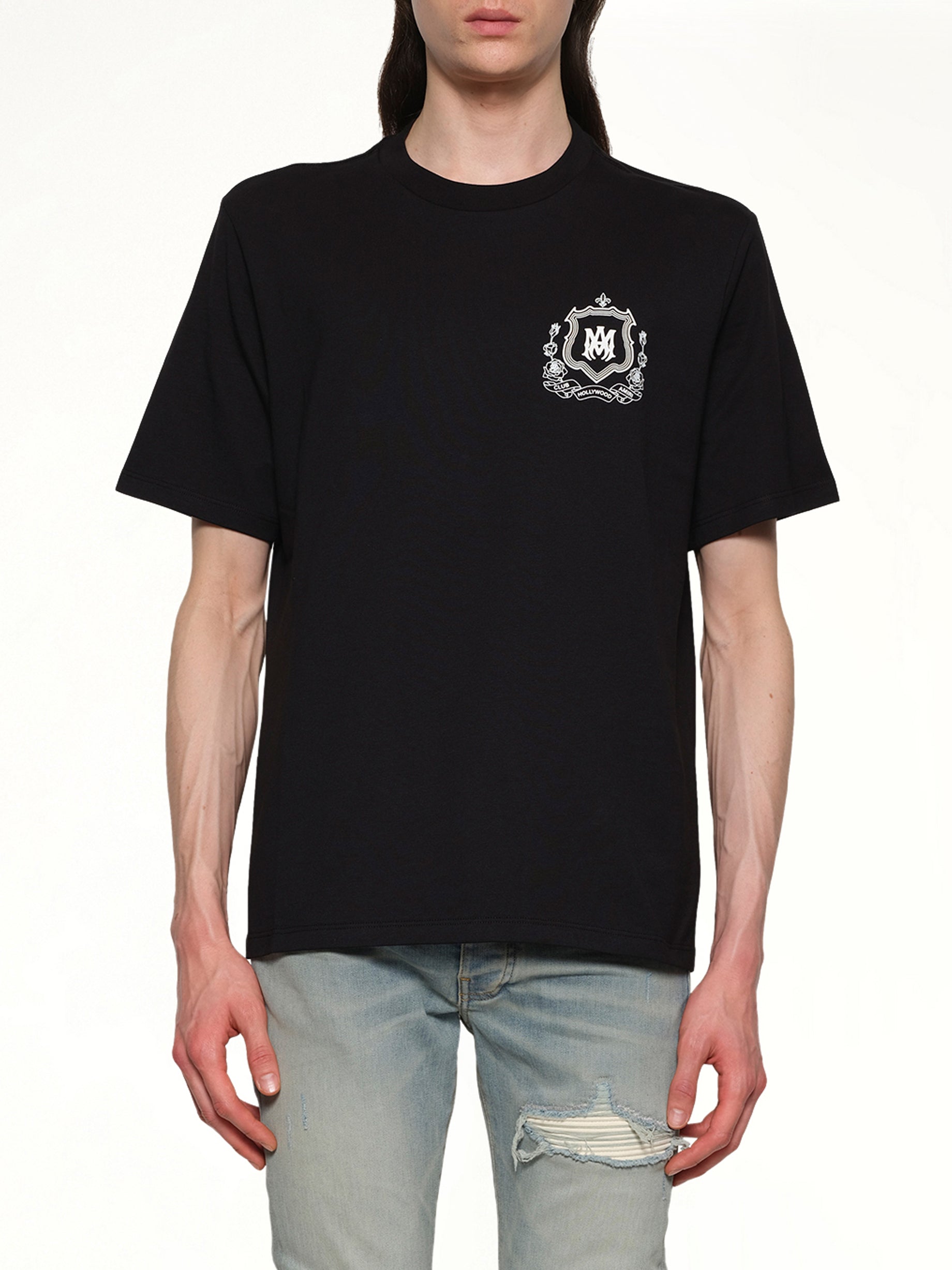 Image of a model wearing Tops. Productname: AMIRI MA Crest Tee in BLACK colour by brand - AMIRI