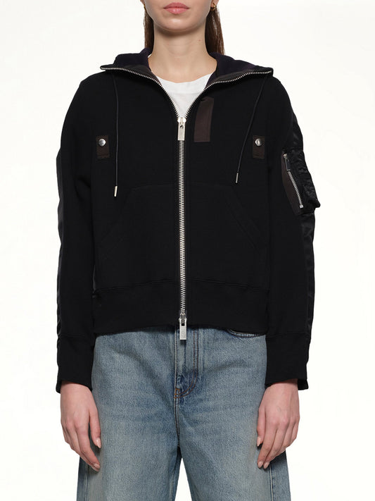 Image of a model wearing Outerwear. Productname: SACAI Sponge x Nylon Twill Hoodie in Black colour by brand - SACAI