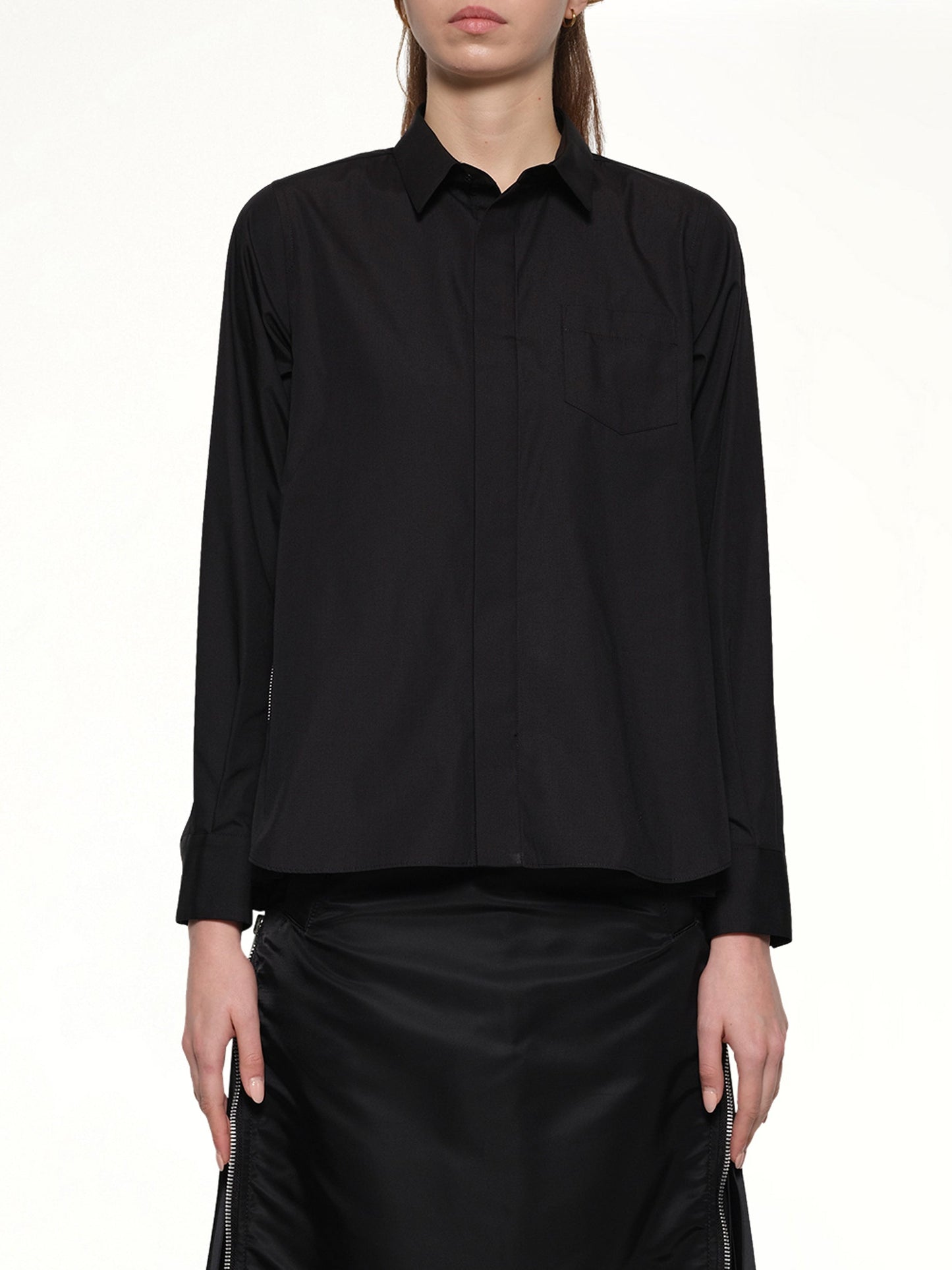 Image of a model wearing Tops. Productname: SACAI Poplin x Chiffon Shirt in Black colour by brand - SACAI
