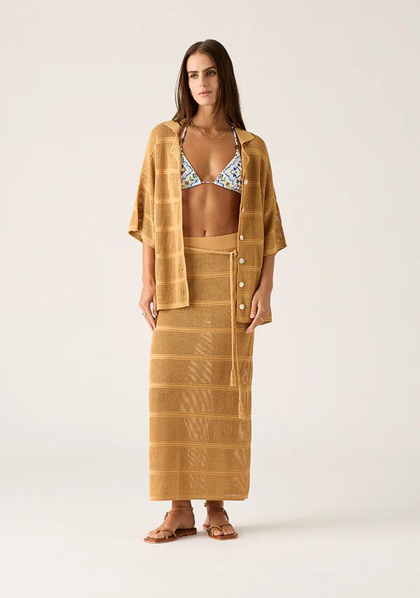 Image of a model wearing Skirts. Productname: Carmen Knit Midi Skirt in Mustard colour by brand - MOS The Label