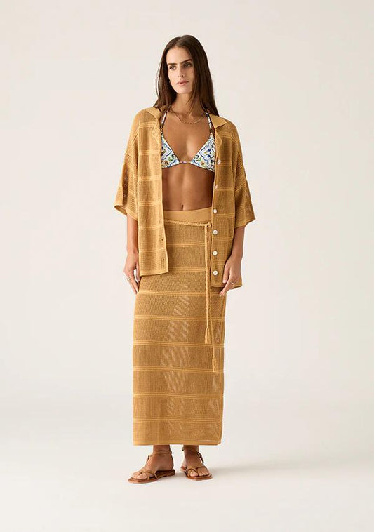 Image of a model wearing Skirts. Productname: Carmen Knit Midi Skirt in Mustard colour by brand - MOS The Label