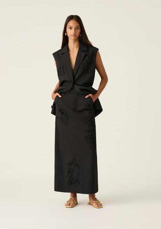 Image of a model wearing Skirts. Productname: Athena Maxi Skirt in Black colour by brand - MOS The Label