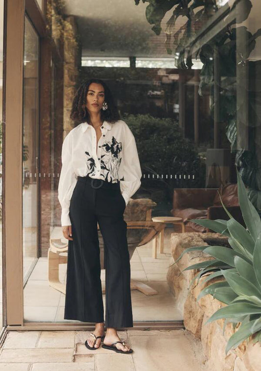 Image of a model wearing Pants. Productname: Lis Wide Leg Pants in Black colour by brand - MOS The Label