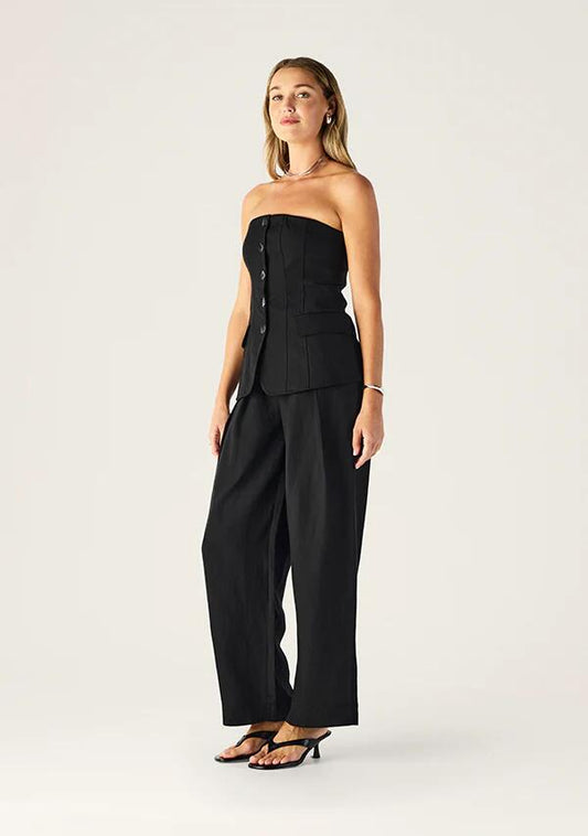 Image of a model wearing Pants. Productname: Monaco Suiting Pants | MOS The Label in Black colour by brand - MOS The Label