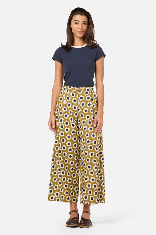 Image of a model wearing Pants. Product name - Janie 60'S Summer Pant in Olive colour by brand - Princess Highway