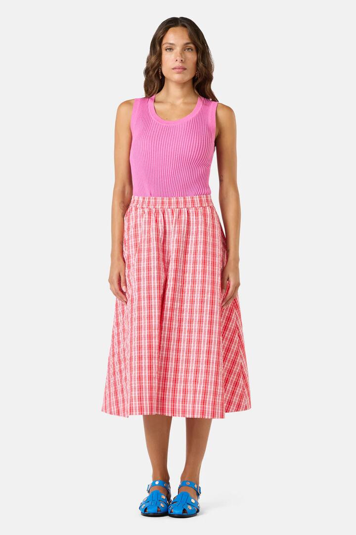 Image of a model wearing Skirts. Product name - Highland Check Skort in Red colour by brand - Gorman