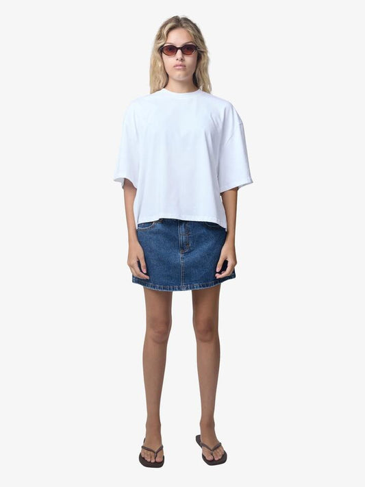 Image of a model wearing Skirts. Productname: Thrills Sophie Mid Rise Mini Skirt in Deep Vintage Blue colour by brand - Thrills