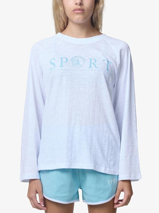 Image of a model wearing Tops. Productname: West Hollywood Sweat Club Sport Oversized Raglan Long Sleeve Tee in White colour by brand - West Hollywood Sweat Club