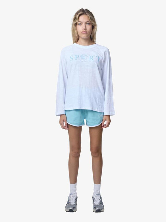 Image of a model wearing Outerwear. Productname: West Hollywood Sweat Club Sport Scalloped Sweatshorts in Mid Blue/White colour by brand - West Hollywood Sweat Club