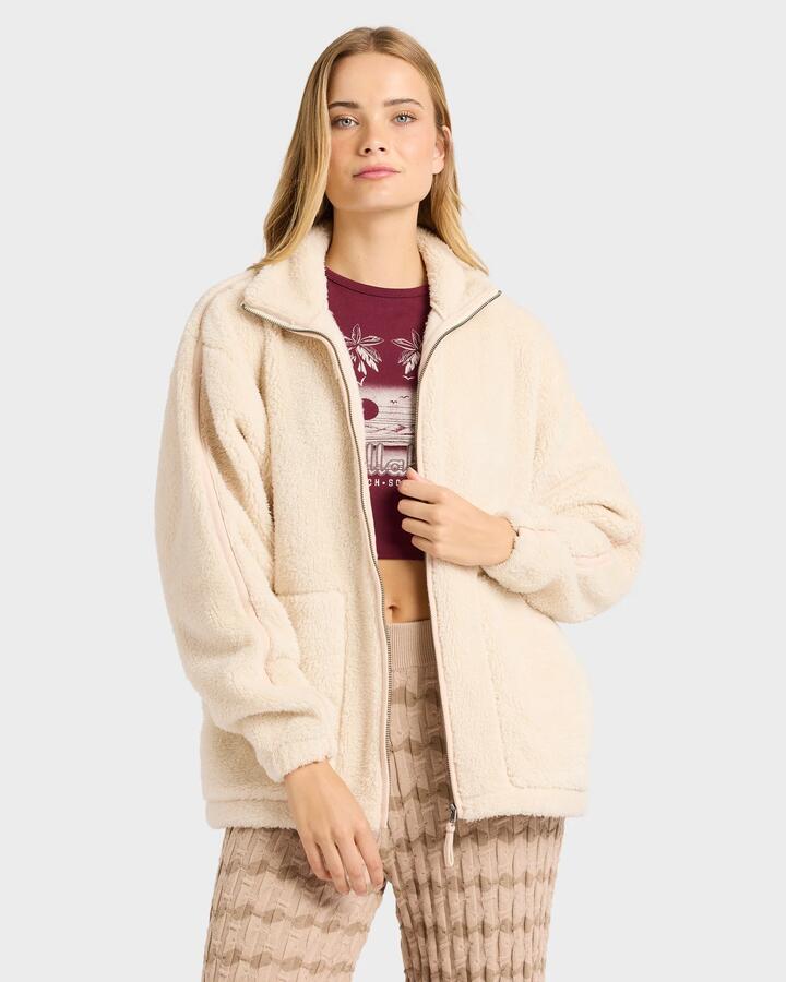 Image of a model wearing Outerwear. Productname: billabong Womens Sweet Ride Zip Fleece Top White Cap - in White Cap colour by brand - Billabong