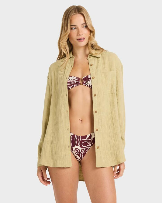 Image of a model wearing Tops. Product name - Billabong Womens Wanderer Long Sleeve Button-Down Shirt Cactus Green in Cactus Green colour by brand - Billabong