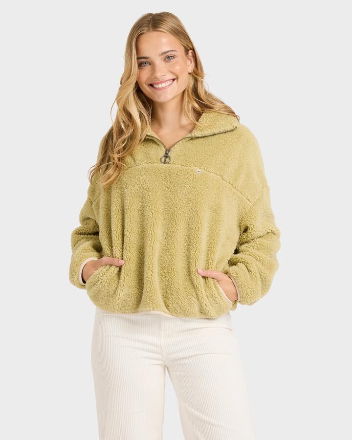 Image of a model wearing Outerwear. Product name - Billabong Womens Groovin Half Zip Fleece Top Coyote - in Coyote colour by brand - Billabong