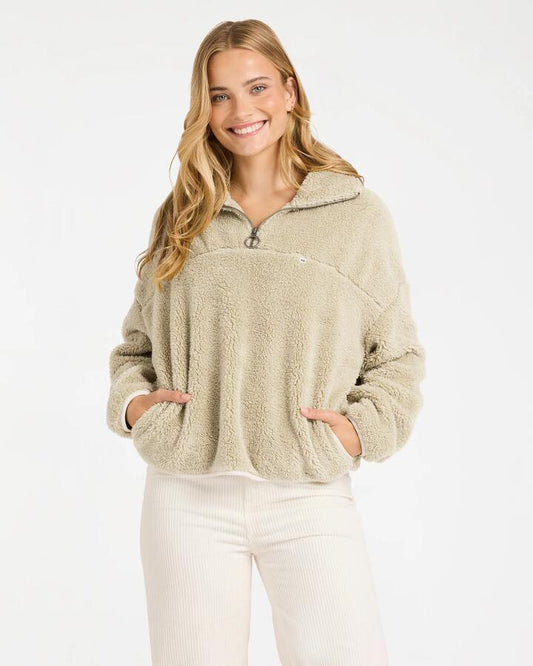 Image of a model wearing Outerwear. Product name - Billabong Womens Groovin Half Zip Fleece Top Coyote in Coyote colour by brand - Billabong