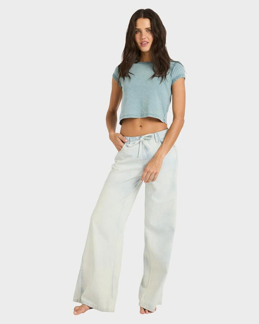 Image of a model wearing Pants. Productname: billabong Womens Jade Saltwashed Wide-Leg Pants Blue Mist - in Blue Mist colour by brand - Billabong