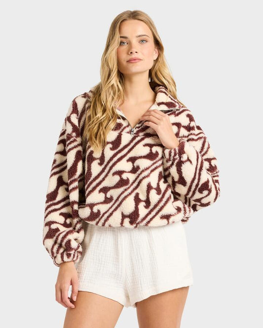 Image of a model wearing Outerwear. Product name - Billabong Womens Dark Wave Half Zip Fleece Top Teak in Teak colour by brand - Billabong