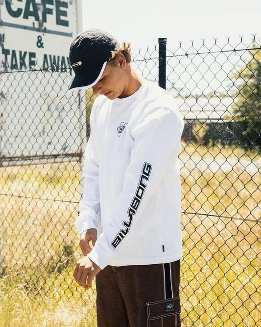 Image of a model wearing Tops. Product name - Billabong Mens Spec 73 Long Sleeve T-Shirt White in White colour by brand - Billabong
