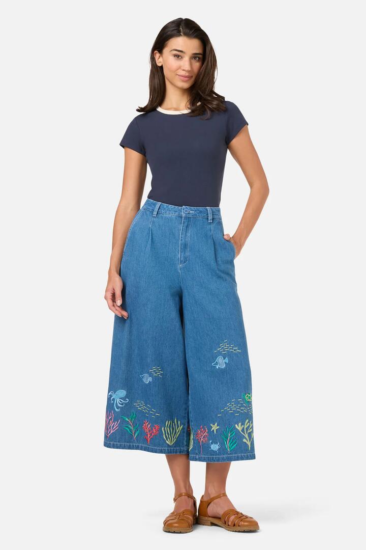 Image of a model wearing Pants. Productname: Sea Embroidered Denim Culotte in Blue Denim colour by brand - Princess Highway