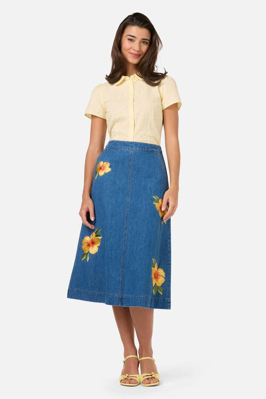 Image of a model wearing Skirts. Product name - Hibiscus Embroidered Denim Skirt in Blue Denim colour by brand - Princess Highway