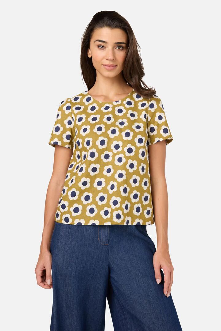 Image of a model wearing Tops. Productname: Janie 60'S Short Sleeve Top in Olive colour by brand - Princess Highway