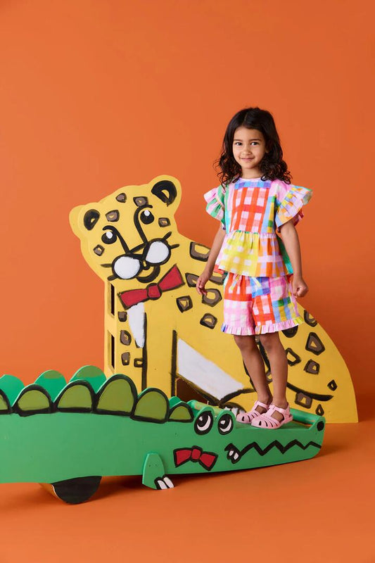 Image of a model wearing Tops. Product name - Vichy Check Kids Frill Top in Multi colour by brand - Gorman