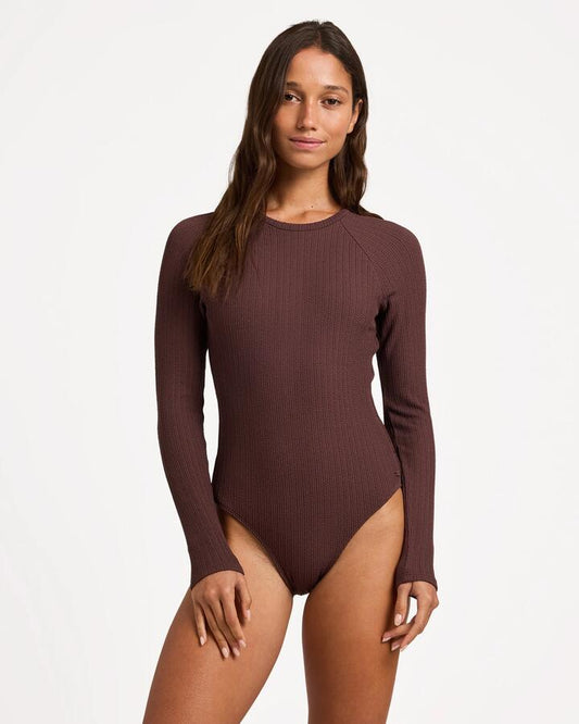 Image of a model wearing Tops. Productname: roxy - Womens Aruba Long Sleeve One Piece Rash Vest - French Roast - in French Roast colour by brand - roxy