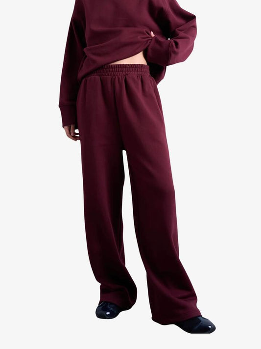Image of a model wearing Pants. Productname: Topshop Straight Leg Jogger in Burgundy colour by brand - Topshop
