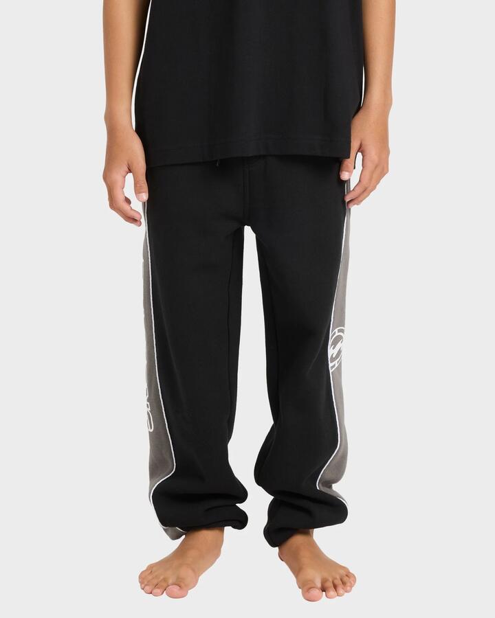 Image of a model wearing Pants. Product name - Billabong Boys 8-16 Bio Wave Trackpants Black in Black colour by brand - Billabong