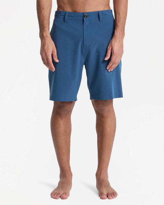 Image of a model wearing Shorts. Productname: quiksilver - Mens Union Heater Amphibian 19" Hybrid Shorts - Dark Denim Heather - in Dark Denim Heather colour by brand - quiksilver