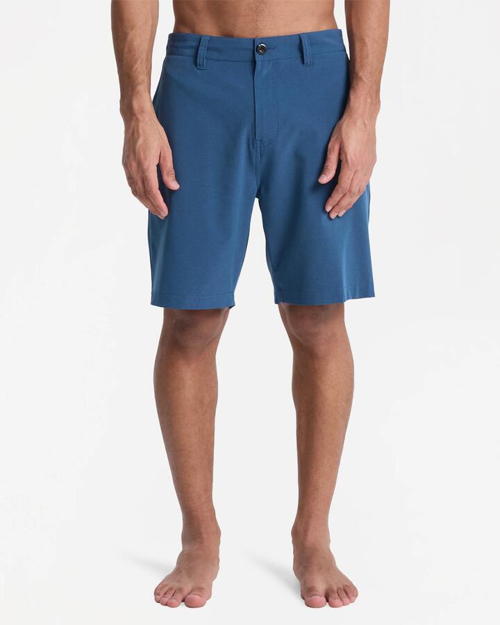Image of a model wearing Shorts. Product name - Quiksilver Mens Union Heather Amphibian 19" Hybrid Shorts Dark Denim Heather in Dark Denim Heather colour by brand - Quiksilver