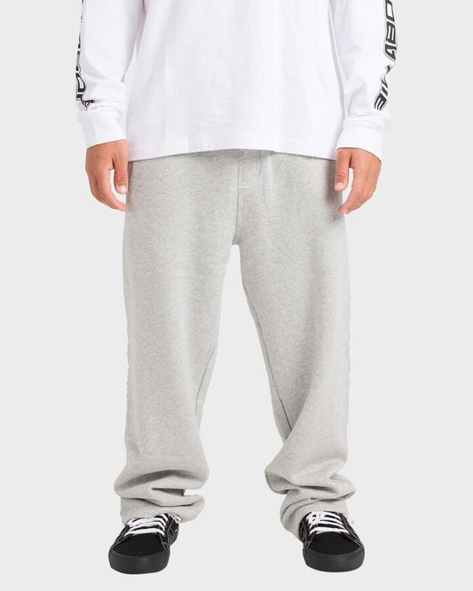 Image of a model wearing Pants. Product name - Billabong Mens Spec 73 Trackpants Light Grey Heather in Light Grey Heather colour by brand - Billabong