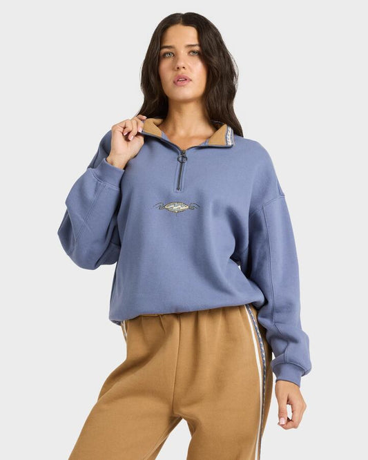 Image of a model wearing Outerwear. Productname: billabong Womens Wave Break Half Zip Fleece Hoodie Stone Blue - in Stone Blue colour by brand - Billabong