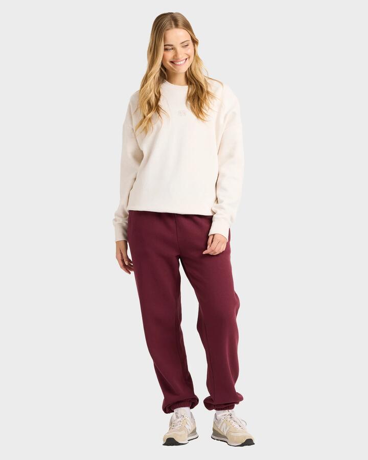 Image of a model wearing Pants. Productname: billabong - Womens Wave Essentials Track Pants - Red Dahlia - in Red Dahlia colour by brand - billabong