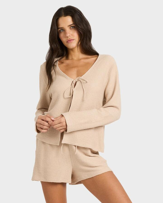 Image of a model wearing Tops. Productname: billabong - Womens Maya Long Sleeve Knitted Top - Oatmeal - in Oatmeal colour by brand - billabong