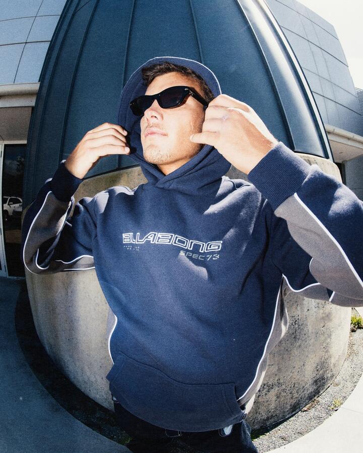 Image of a model wearing Outerwear. Product name - Billabong Mens Spec 73 Pop Pullover Hoodie Vintage Indigo in Vintage Indigo colour by brand - Billabong