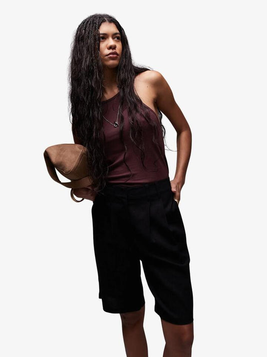 Image of a model wearing Shorts. Productname: Topshop Linen Longline Shorts in Black colour by brand - Topshop