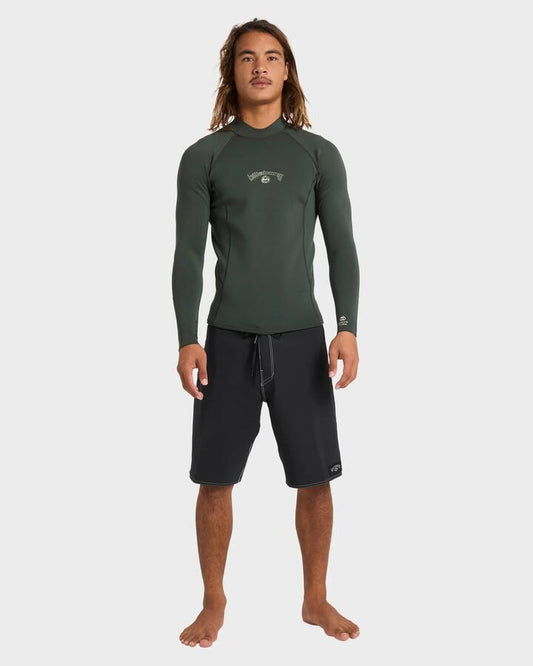 Image of a model wearing Tops. Productname: billabong - Mens 1/1Mm Absolute Natural Long Sleeve Wetsuit Top - Forest - in Forest colour by brand - billabong