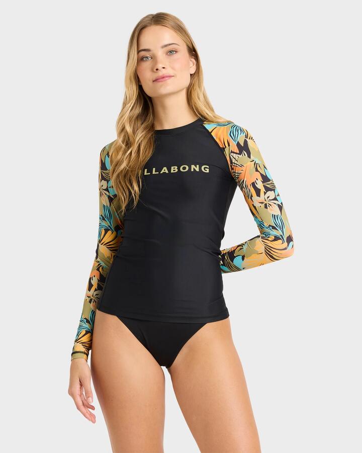 Image of a model wearing Tops. Product name - Billabong Womens Des Tropiques Long Sleeve Rashvest Black Multi in Black Multi colour by brand - Billabong