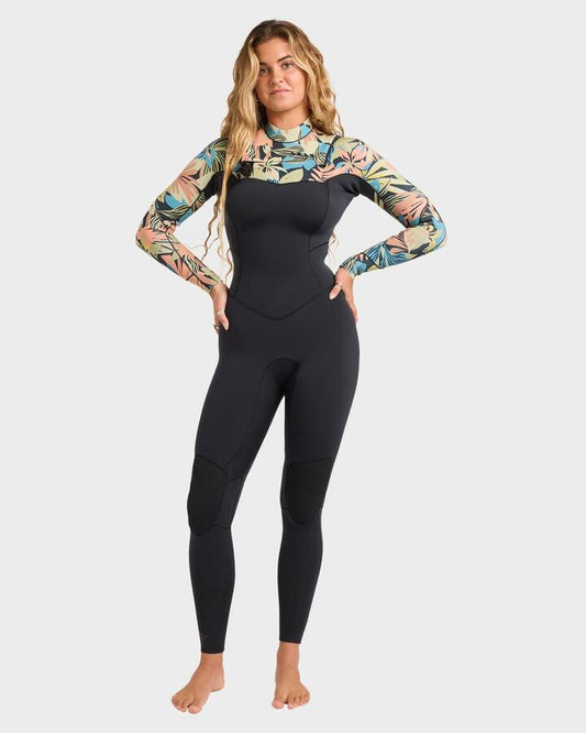 Image of a model wearing Tops. Productname: billabong - Womens 3/2Mm Salty Dayz Chest Zip Wetsuit - Black Tropical - in Black Tropical colour by brand - billabong